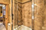 Master bathroom with dual sink vanity, separate shower and bathtub